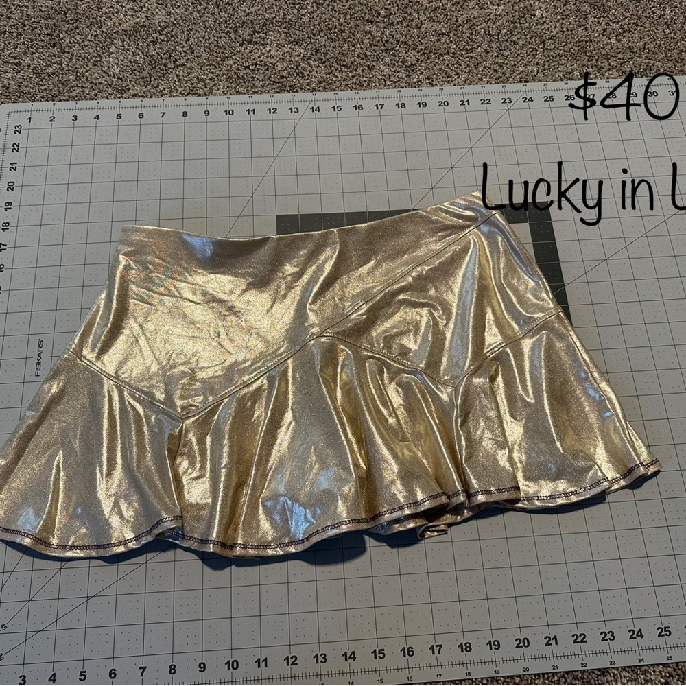 Lucky in love metallic gold skirt with nave and red stitching.  NWT